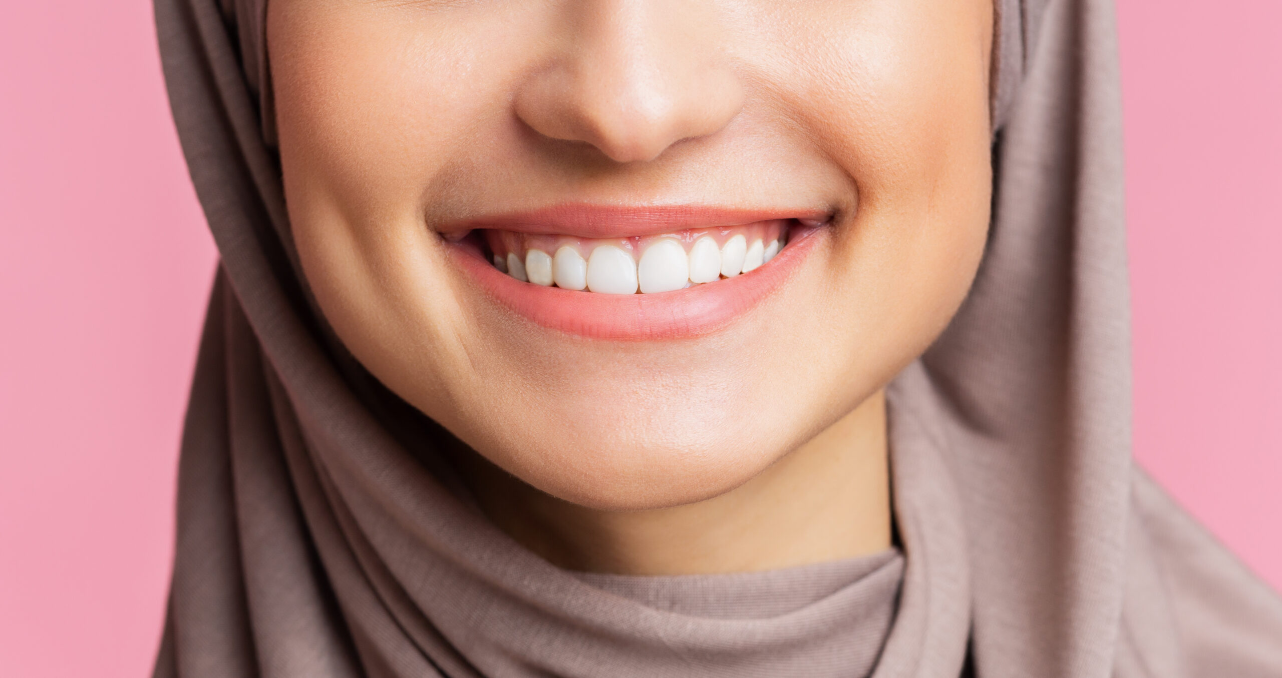 Dental care and stomatology concept. Closeup of wide white smile of muslim girl in hijab, young islamic woman happy after teeth alignment procedure